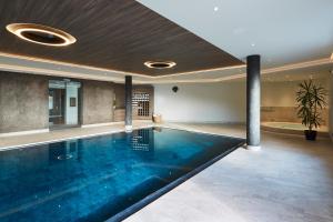 a swimming pool in a house at Residence La Selva in Selva di Val Gardena