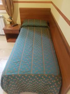 Postel nebo postele na pokoji v ubytování B&B Antica Trattoria