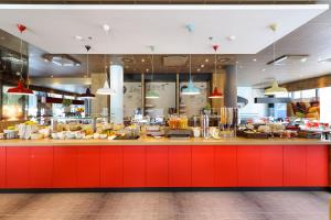 
a kitchen filled with lots of counter space at ibis Wien Hauptbahnhof in Vienna
