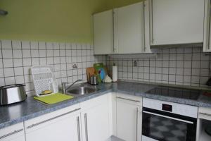 a kitchen with a sink and a counter top at Ferienwohnung Meuser in Traben-Trarbach