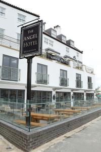 a sign for the angel hotel in front of a building at The Angel Hotel Wetherspoon in Whitby