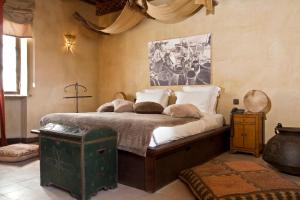 Un pat sau paturi într-o cameră la Villa De L'Ô