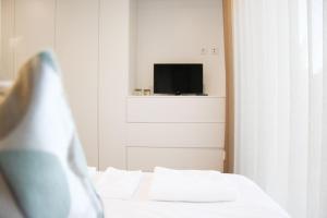A bed or beds in a room at Braga Center Apartments