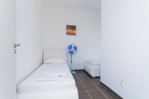 Postel nebo postele na pokoji v ubytování Villa TINA