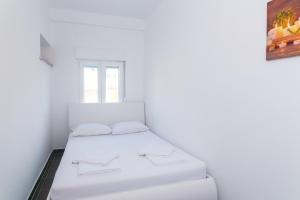 Postel nebo postele na pokoji v ubytování Villa TINA