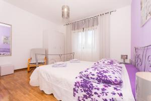 Postel nebo postele na pokoji v ubytování Apartment Lorenzo