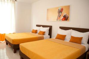 Postel nebo postele na pokoji v ubytování Hotel Condina Pereira