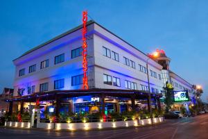 a building with a lighthouse on top of it at Hotel Elegance NV in Paramaribo