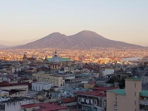 a view of a city with a mountain in the background at Buonanotte & Buongiorno Guesthouse in Naples
