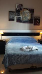 Кровать или кровати в номере First Class Apartments