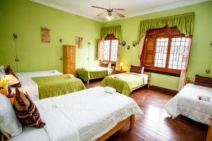 Cama ou camas em um quarto em Lima Wari Hotel Boutique