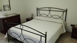 מיטה או מיטות בחדר ב-Agriturismo Costiera Amalfitana