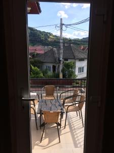 a view of a patio with a table and chairs at Provincial in Vişeu de Jos