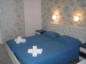 Posteľ alebo postele v izbe v ubytovaní Limani Apartments