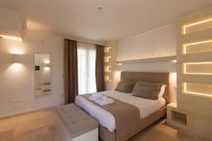 Postel nebo postele na pokoji v ubytování Montiro' Hotel