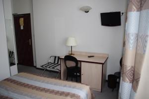 Postel nebo postele na pokoji v ubytování Hôtel du Lion
