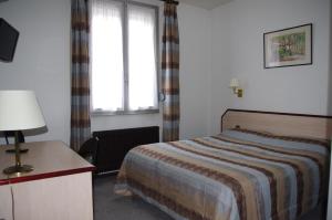 Postel nebo postele na pokoji v ubytování Hôtel du Lion