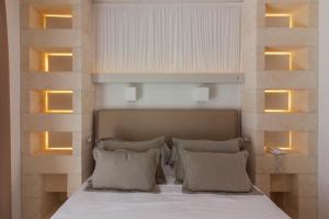 Postel nebo postele na pokoji v ubytování Montiro' Hotel
