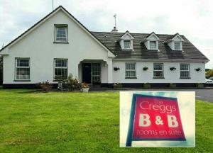a house with a sign in front of it at The Creggs in Ballyvaughan