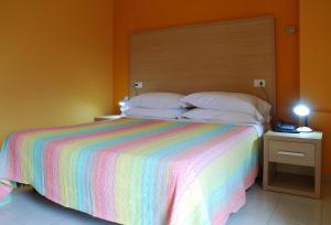 Postel nebo postele na pokoji v ubytování Hotel Michelangelo