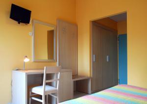 Postel nebo postele na pokoji v ubytování Hotel Michelangelo