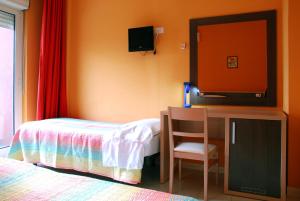 Postel nebo postele na pokoji v ubytování Hotel Michelangelo