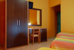 Postel nebo postele na pokoji v ubytování Hotel Michelangelo