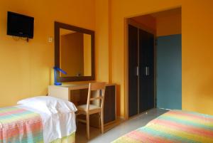 Postel nebo postele na pokoji v ubytování Hotel Michelangelo