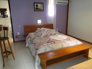 Cama ou camas em um quarto em Pousada Caúca
