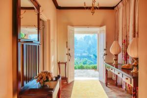 a hallway with a door leading into a room at Oatlands by Jetwing in Nuwara Eliya