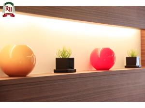 a row of three vases sitting on a shelf at Richmond Hotel Tokyo Shiba in Tokyo