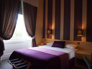 Postel nebo postele na pokoji v ubytování Thistle Hotel