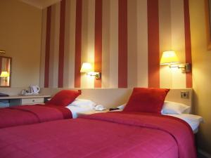 Postel nebo postele na pokoji v ubytování Thistle Hotel