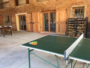 a ping pong table in front of a building at Agriturismo Corte Bertesina in Vicenza