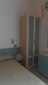 Postel nebo postele na pokoji v ubytování Hotel Garden