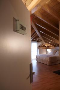 Postel nebo postele na pokoji v ubytování Hotel Nagusi