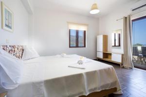 Postel nebo postele na pokoji v ubytování Seaside Villa Balos