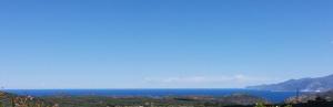 a view of the ocean from a hill at La Canardiere in Casta