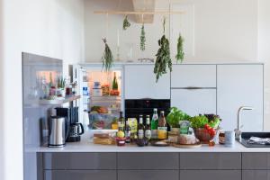 a kitchen counter with food and drinks on it at Landhaus 3 Birken in Landkern