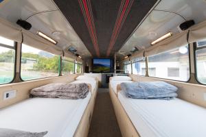 A bed or beds in a room at Bed In Bus