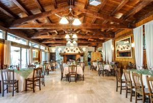 a dining room with tables and chairs in it at Tenuta Del Varco in Varco Sabino