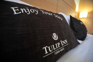 Postel nebo postele na pokoji v ubytování Tulip Inn Turin West Rivoli