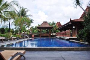 The swimming pool at or close to Java Village Resort by HOMEE Yogyakarta