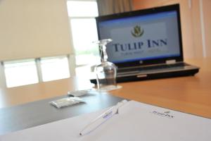 TV a/nebo společenská místnost v ubytování Tulip Inn Turin West Rivoli
