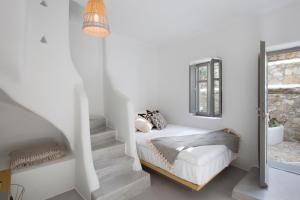 Postel nebo postele na pokoji v ubytování Dreambox Mykonos Suites
