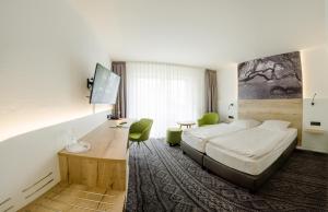 Кровать или кровати в номере Landgasthaus Fischer