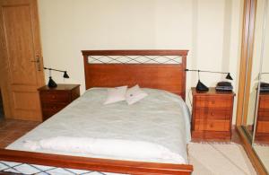 Quinta da Perdiz Country House tesisinde bir odada yatak veya yataklar