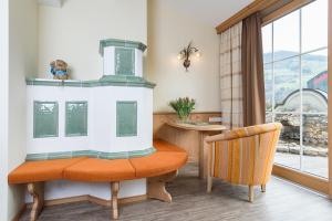 
a kitchen with a table and chairs in it at Wohlfühlhotel Garni KERSCHDORFER - adults only in Kaltenbach
