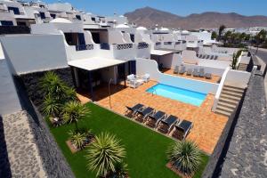 an aerial view of a house with a swimming pool at Villa Yucas in Playa Blanca