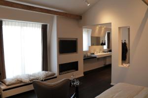 TV a/nebo společenská místnost v ubytování B&B For 2-Wellness For 2